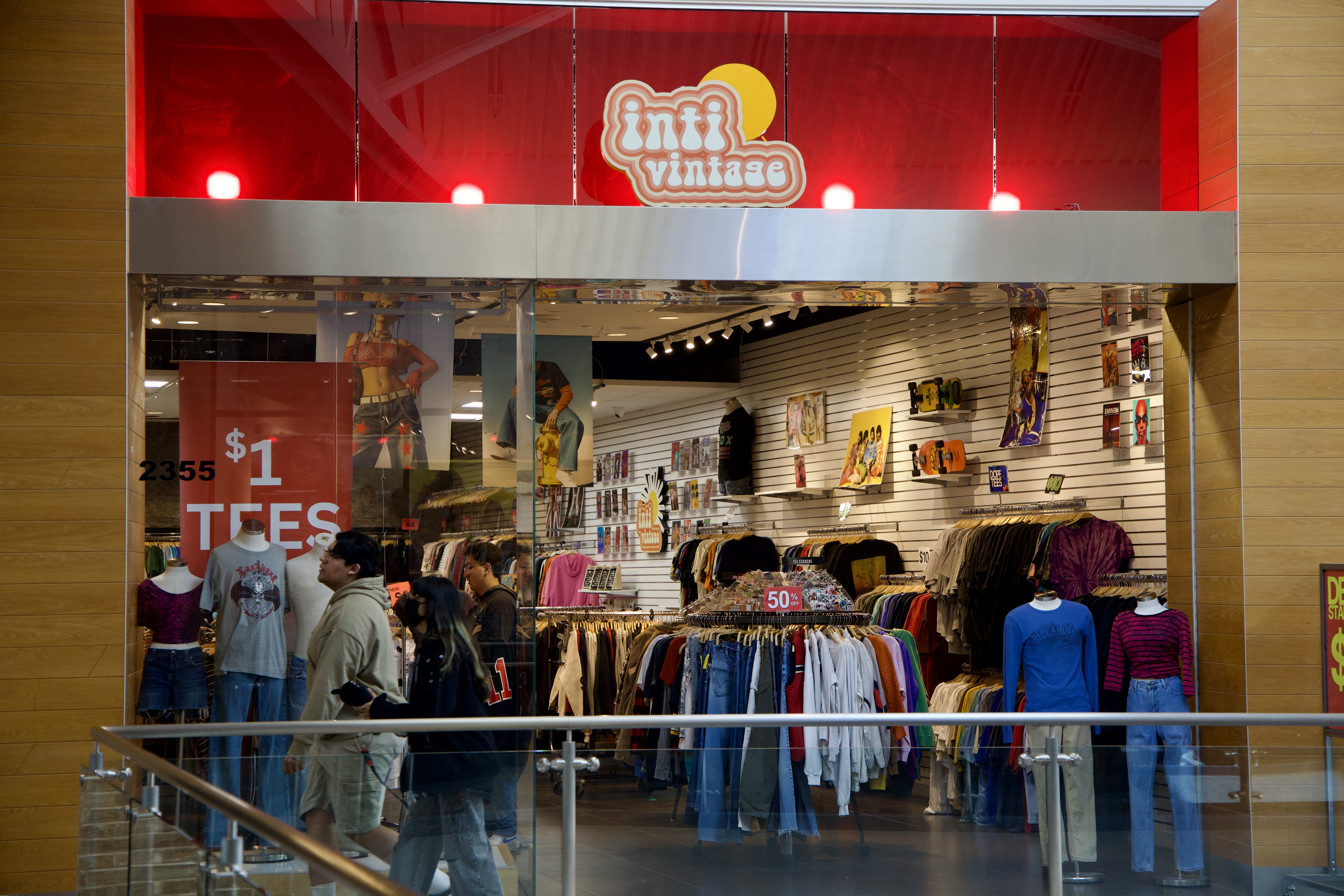 Inti Vintage storefront at Promenade Temecula — customers browsing vintage clothing